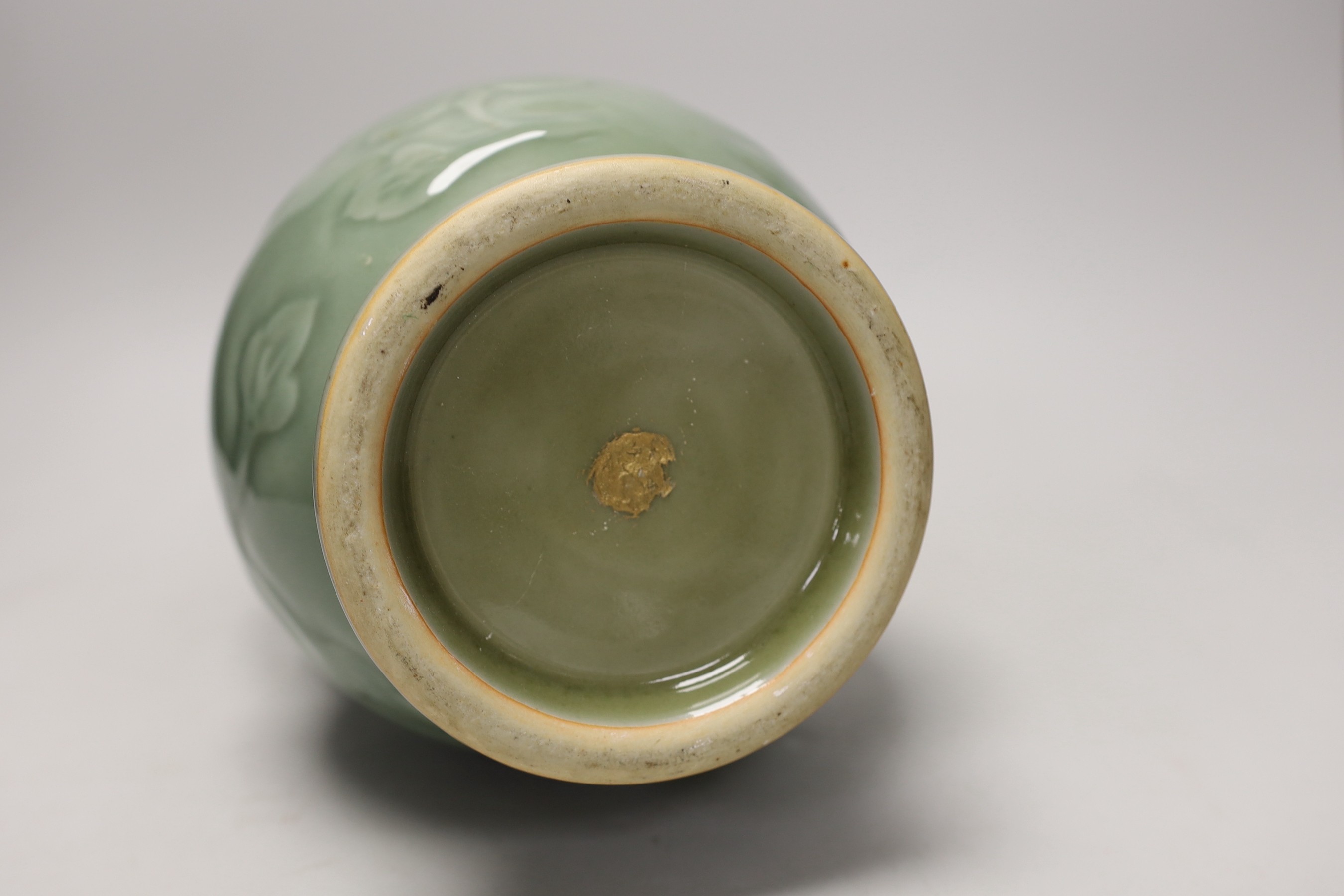 A two handled Chinese celadon glazed vase. 32cm tall